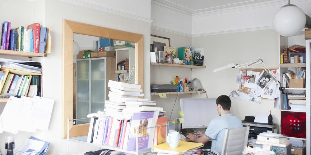 RearViewOfBusinessmanUsingComputerInCreativeOfficeSpace - Superior Housekeeping Service, LLC Where Exceptional Service & Affordability Meet!